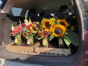 an image of our flowers going to market